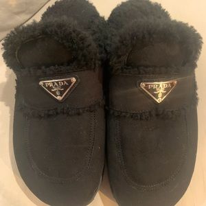 Gorgeous Prada slippers with Suede exterior and shearling.